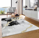 Modern living room with a decorative rug featuring abstract patterns.