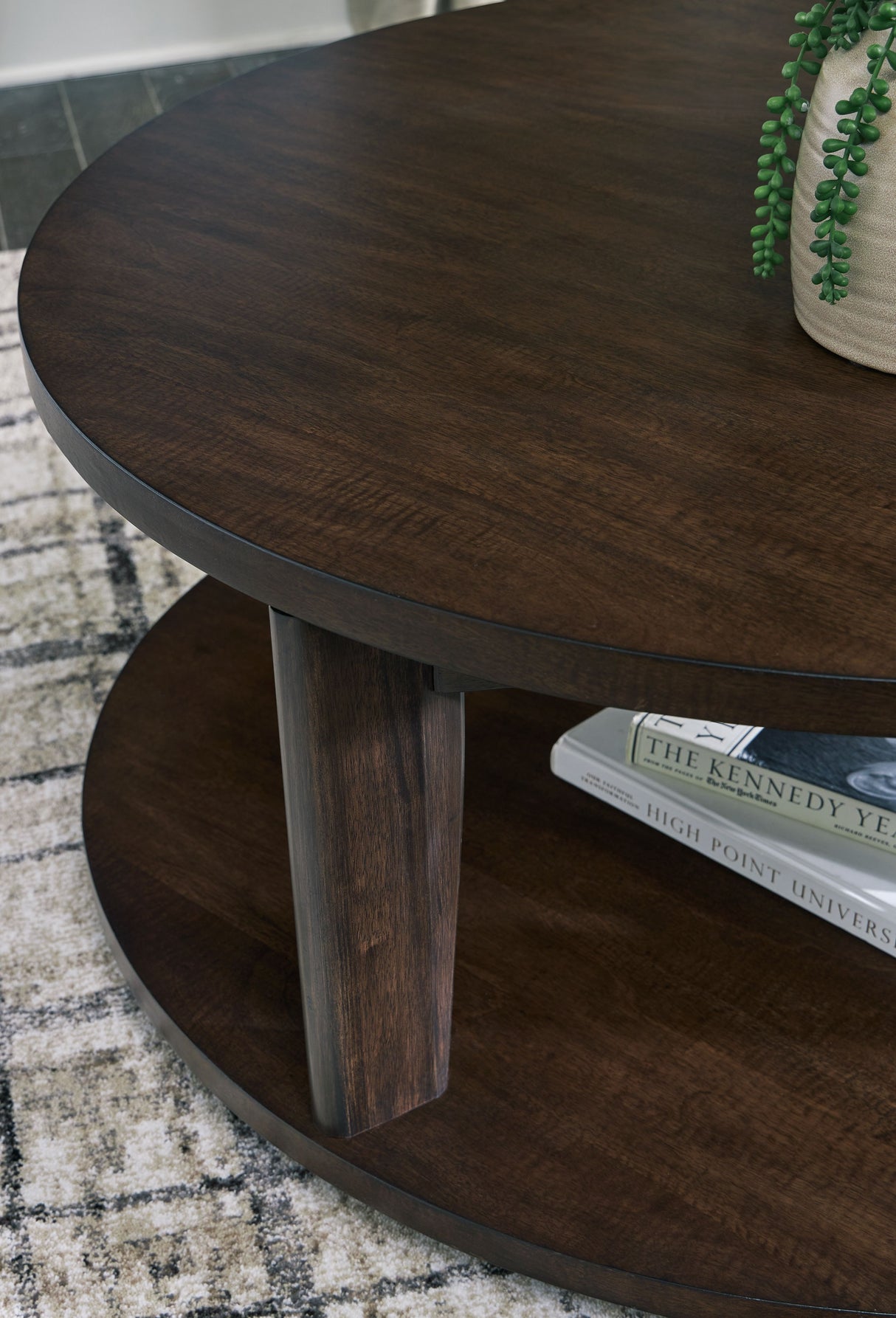 Korestone 2 - Dark Brown - Round Cocktail Table by Signature Design by Ashley® | Bel Furniture