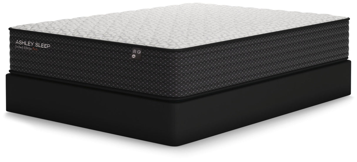 Ashley Sleep Limited Edition Firm Innerspring Mattress on black foundation, side view - Bel Furniture