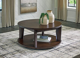 Korestone 2 - Dark Brown - Round Cocktail Table by Signature Design by Ashley® | Bel Furniture