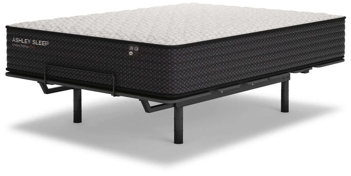 Ashley Sleep Limited Edition Firm innerspring mattress on black adjustable bed frame, gray quilted top view
