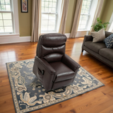 Brown leather recliner chair on a decorative rug in a living room setting.