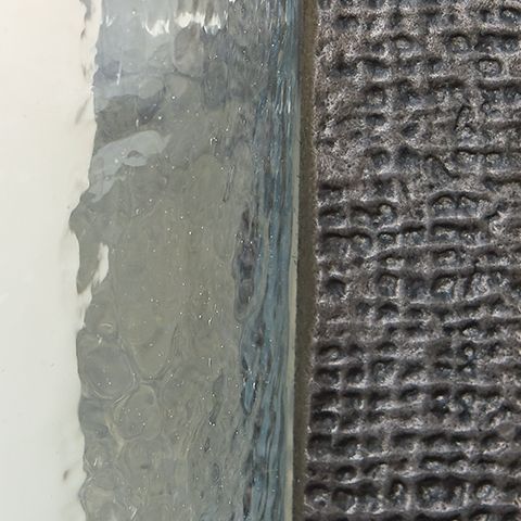 Garekton - Clear / Pewter Finish - Candle Holder Set (Set of 2) by Signature Design by Ashley® | Bel Furniture