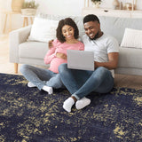 Maval - 6' X 9' Washable Area Rug - Black / Gold