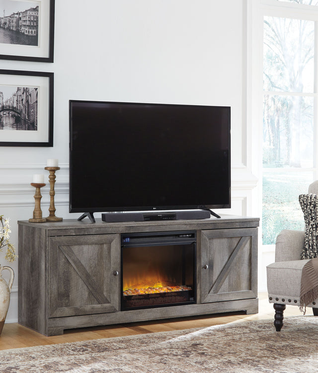 Wynnlow - Gray - 63" TV Stand With Glass/Stone Fireplace Insert by Signature Design by Ashley® | Bel Furniture